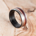 Fire-blackened titanium with copper liner and Mopane wood ring. Engagement ring, wedding ring.